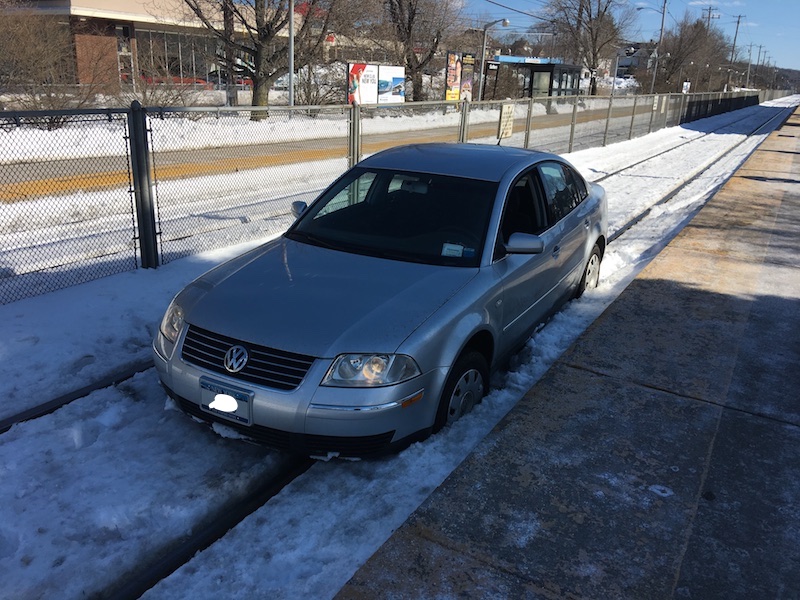 Car on Train Tracks